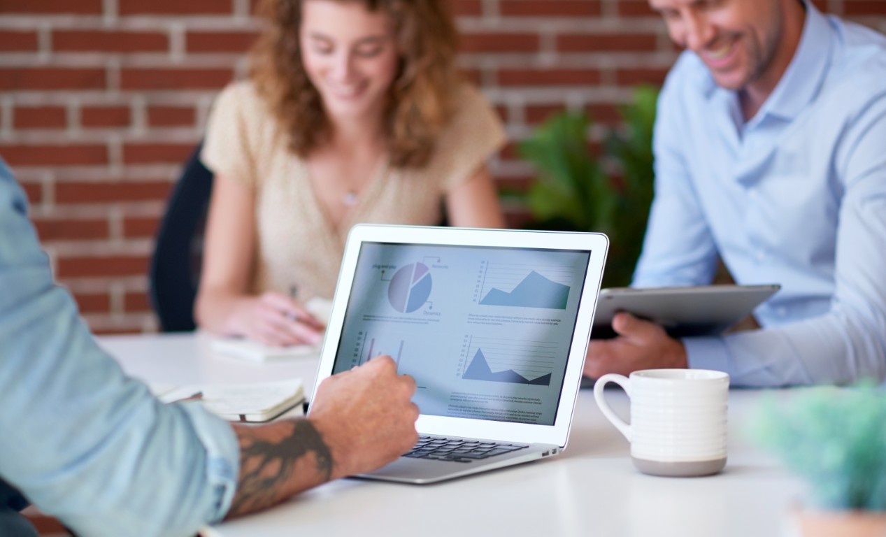 Business professionals in a meeting discussing advertising strategies